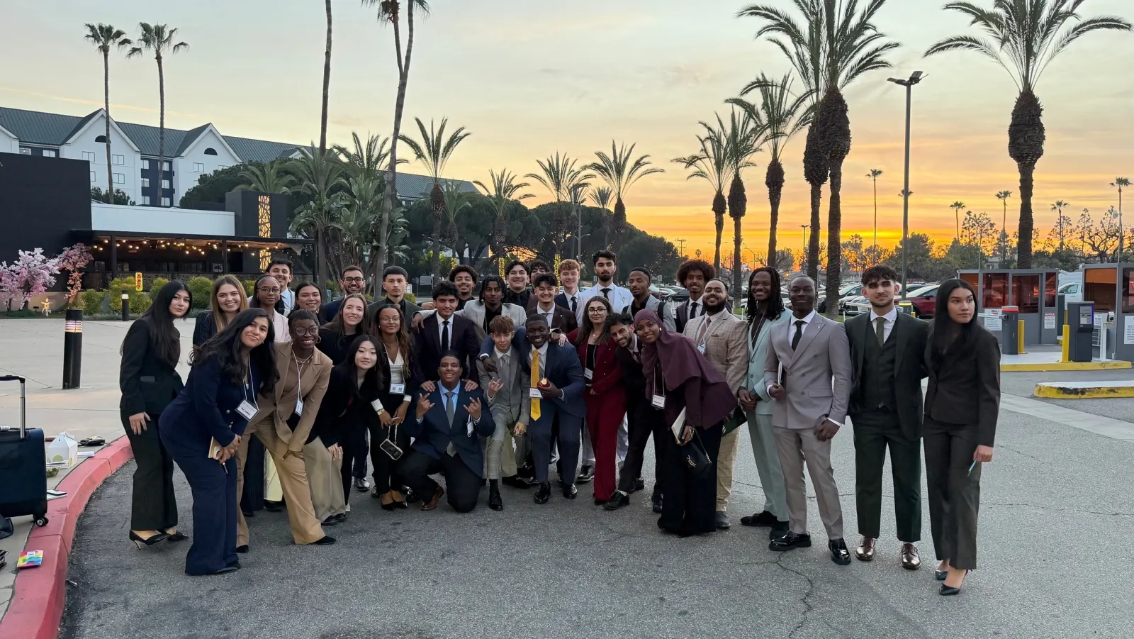 The White Whale Marketing team gathered together outdoors at sunset