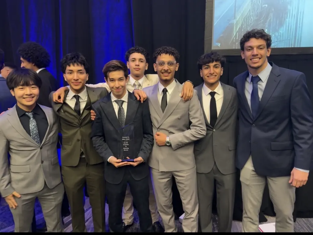 White Whale Marketing team members celebrating with an award