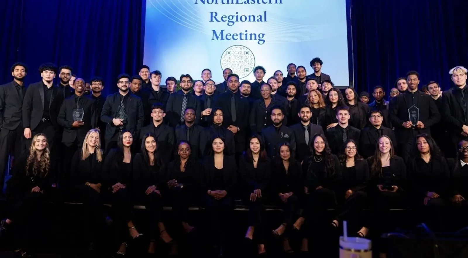 White Whale Marketing team on stage at a regional meeting